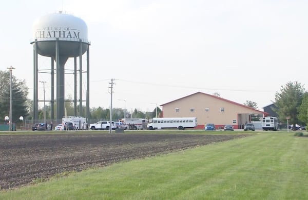 This image taken from video provided by WCIA shows first responders working the scene after a car smashed through a building during an after-school program, killing multiple people Monday, April 28, 2025, in Chatham, Ill. (WCIA via AP)