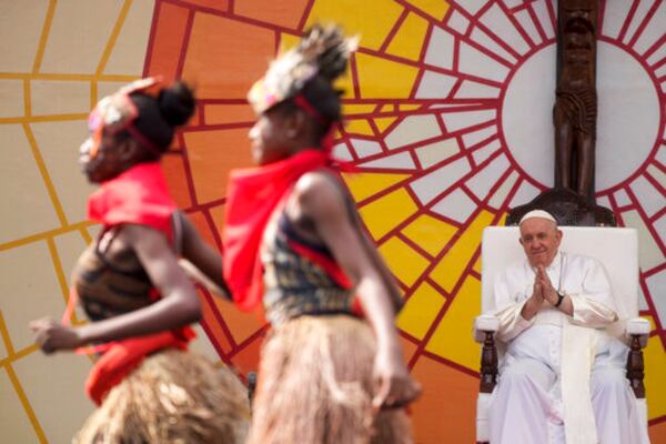 FILE - Pope Francis looks at traditional dancers performing at the Martyrs' Stadium In Kinshasa, Democratic Republic of Congo, Thursday, Feb. 2, 2023. (AP Photo/Gregorio Borgia, File)