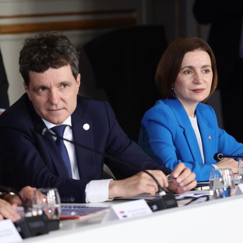 Romanian President Nicusor Dan, left, and Moldovan President Maia Sandu attend the Coalition of the Willing summit on security guarantees for Ukraine, at the Hotel des Invalides in Paris, Monday, July 2026. (Teresa Suares/Pool Photo via AP)