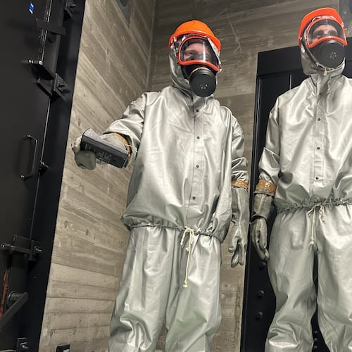 Finnish conscripts measure radiation levels at a shelter in Kuopio, Finland, during a civil defense exercise Wednesday, Sept. 2, 2026. (AP Photo/Emma Burrows)
