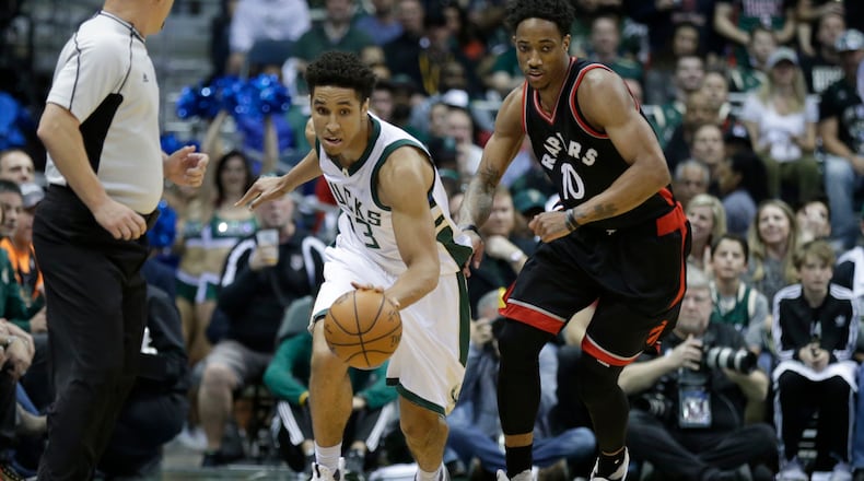 Malcolm Brogdon (13) of the Milwaukee Bucks dribbles the basketball up the court with DeMar DeRozan of the Toronto Raptors defending during the first half of Game Four of the Eastern Conference Quarterfinals during the 2017 NBA Playoffs at the BMO Harris Bradley Center on April 22, 2017 in Milwaukee, Wisconsin. (Photo by Mike McGinnis/Getty Images)