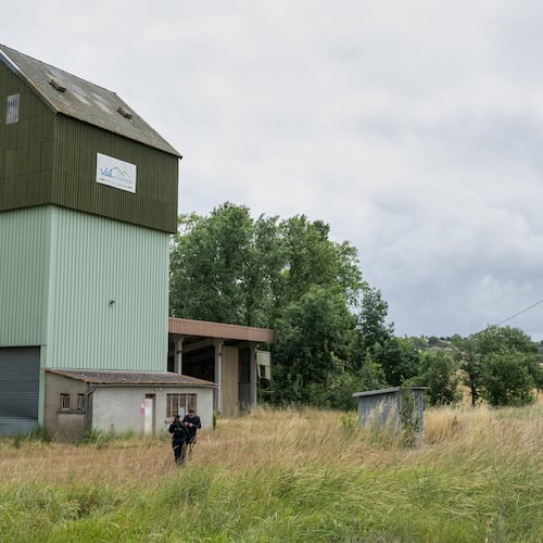French police guard a farm silo where a body was found yesterday during the search to find missing 11 year-old girl Lyhanna in Puycasquier, southwestern France, Friday, June,5, 2026. (AP Photo/Frederic Lancelot)