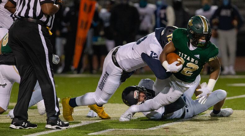 Justice Haynes (22), sophomore running back for Blessed Trinity,
gets tackled while running the ball during the Blessed Trinity vs. Decatur high school football game on Friday, December 4, 2020, at Blessed Trinity high school in Roswell, Georgia. Blessed Trinity defeated Decatur 44-0 in the second round playoff game. CHRISTINA MATACOTTA FOR THE ATLANTA JOURNAL-CONSTITUTION.