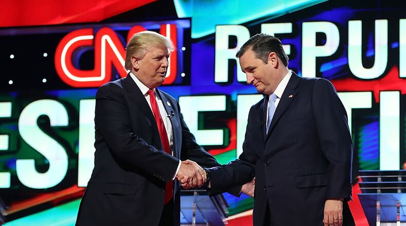 CORAL GABLES, FL - MARCH 10: Republican presidential candidates Donald Trump and Sen. Ted Cruz (R-TX) shakes hands on stage as they arrive for the CNN, Salem Media Group, The Washington Times Republican Presidential Primary Debate on the campus of the University of Miami on March 10, 2016 in Coral Gables, Florida. (Photo by Joe Raedle/Getty Images)