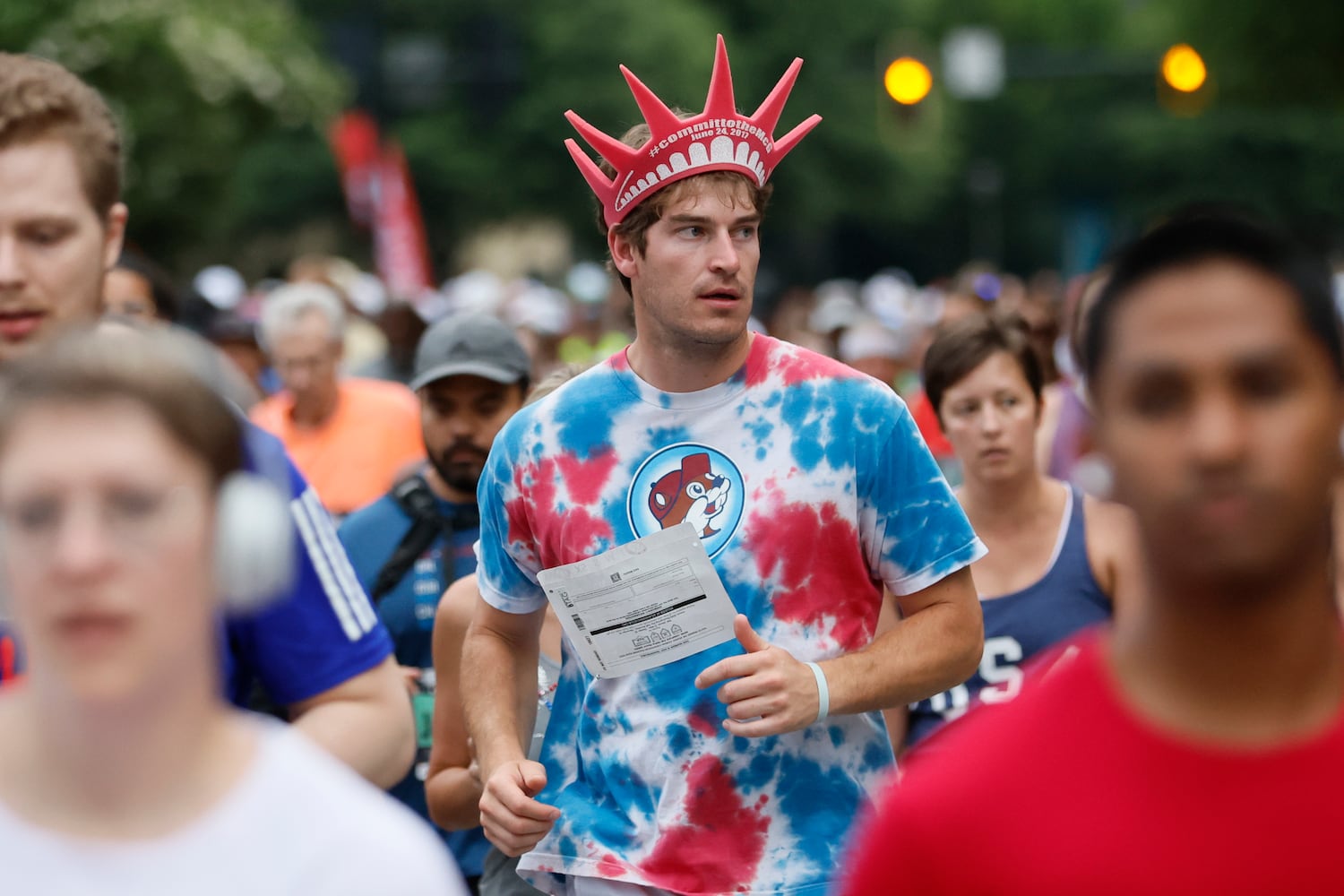 Runners on Peachtree Street during the 54th running of the Atlanta Journal-Constitution Peachtree Road Race on Tuesday, July 4th, 2023. (Miguel Martinez / Miguel.MartinezJimenez@ajc.com)