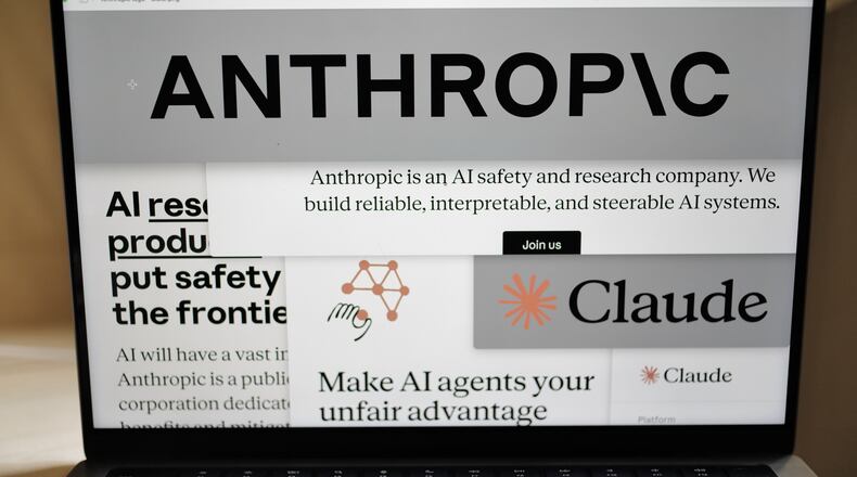FILE - Pages from the Anthropic website and the company's logos are displayed on a computer screen in New York, Feb. 26, 2026. (AP Photo/Patrick Sison, File)