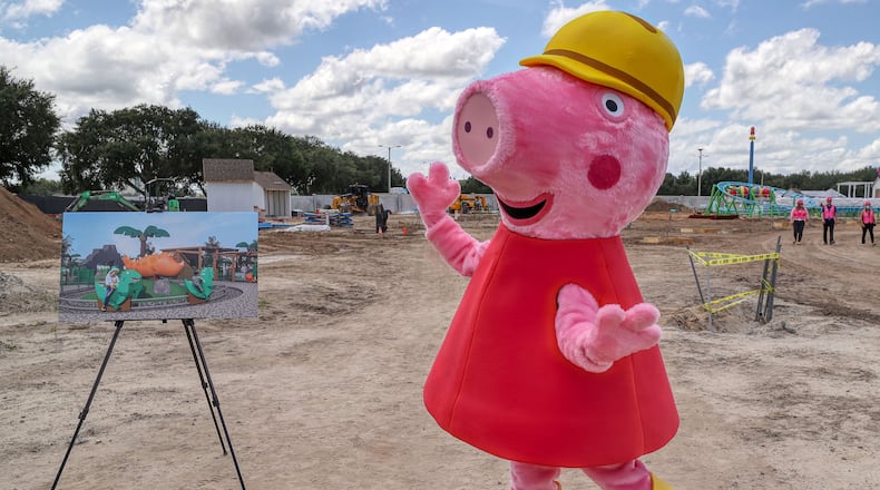 In a high-dynamic-range composite image, Peppa Pig makes an appearance during a media tour of the Peppa Pig Theme Park construction progress, on August 19, 2021. The park, located "just steps from Legoland Florida Resort," is scheduled to open in 2022. (Ricardo Ramirez Buxeda/Orlando Sentinel/TNS)