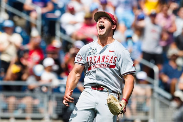 Arkansas pitcher Gage Wood celebrates after striking out the final Murray State batter in the eighth inning of an NCAA College World Series baseball game in Omaha, Neb., Monday, June 16, 2025. (Chris Machian/Omaha World-Herald via AP)