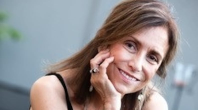 Marilyn Suriani, a respected Atlanta photographer, produced the groundbreaking book "Dancing Naked in the Material World" about Atlanta's exotic dancers, as well as projects on Atlanta's store front churches, women in prison and fine art images. She was a recipient of an NEA fellowship, an artist in residence at the National School of Photography in Arles, France, and her work is in collections in the U.S .and abroad. Photo by Billy Howard