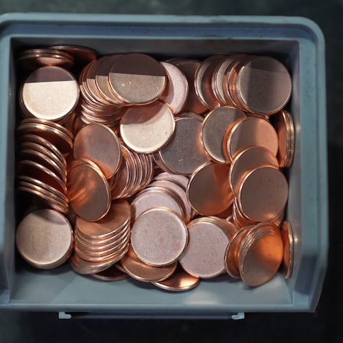 Blank coins wait to be the last pennies pressed at the U.S. Mint in Philadelphia, Wednesday, Nov. 12, 2025. (AP Photo/Matt Slocum)