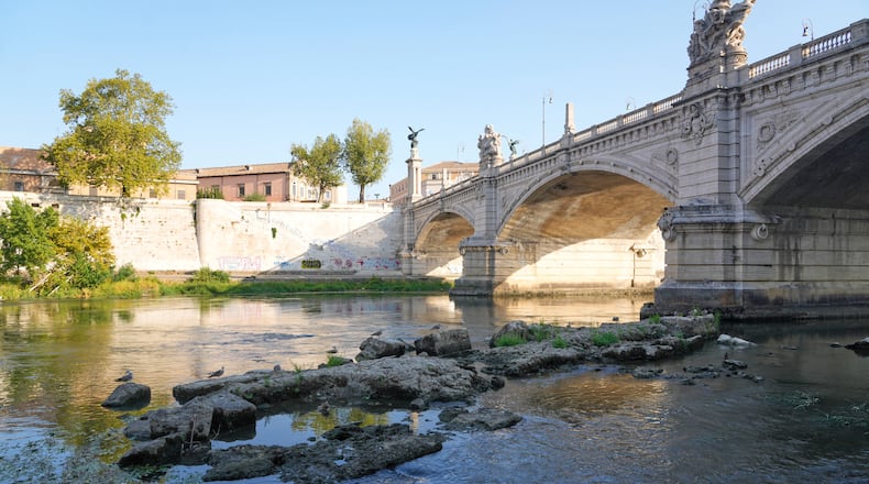 The ruins of the ancient Roman Neronian bridge, emerge from the riverbed of the Tiber river due to drought, in Rome, Thursday, Aug. 13, 2026. (AP Photo/Gregorio Borgia)