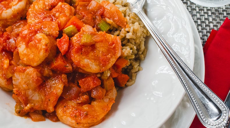 A healthy and hearty bowl of Shrimp Creole in spiced tomato gravy over brown rice. (Styling by Cynthia Graubart / Virginia Willis for the AJC)