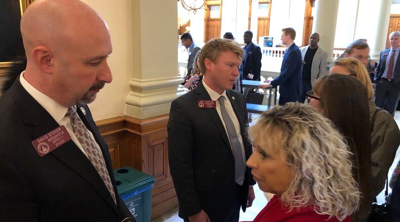 State Reps. David Stover (left) and Matt Gurtler (center) speak to activists and citizens on March 7, 2019. Chris Joyner / chris.joyner@ajc.com