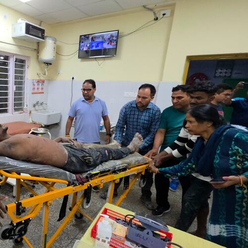 An injured person is moved for treatment at a hospital after the collapse of an under-construction tunnel at a hydropower project in Chamoli district of Uttarakhand, India, Thursday, Aug. 13, 2026. (AP Photo/Surendra Rawat)