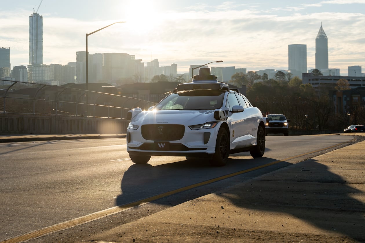 A Waymo self-driving taxi travels down 17th Street in Atlanta, Thursday, Dec. 11, 2025 (Ben Hendren for the AJC)