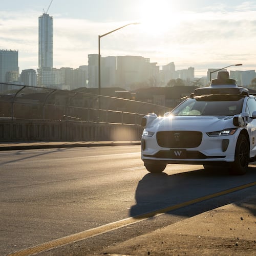 A Waymo self-driving taxi travels down 17th Street in Atlanta, Thursday, Dec. 11, 2025 (Ben Hendren for the AJC)
