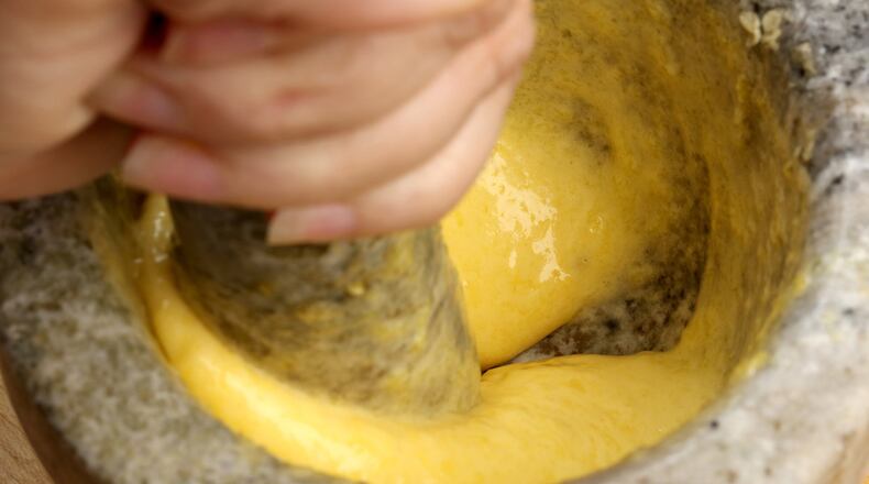 Keep adding the oil until you have a silky smooth sauce and you’ve used all the oil. (Michael Tercha/Chicago Tribune/TNS)