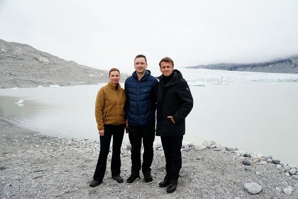 French President Emmanuel Macron, right, Danish Prime Minister Mette Frederiksen, left, and Greenlandic leader Jens-Frederik Nielsen at a glacier in Greenland, Sunday, June 15, 2025. (Mads Claus Rasmussen/Ritzau Scanpix via AP)