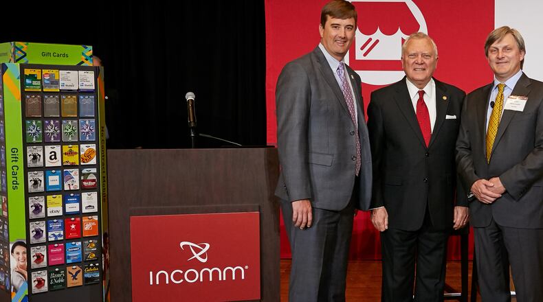 From left: Bert Brantley, chief operating officer at the state Department of Economic Development, Gov. Nathan Deal and Scott Meyerhoff, COO and chief financial officer of InComm.