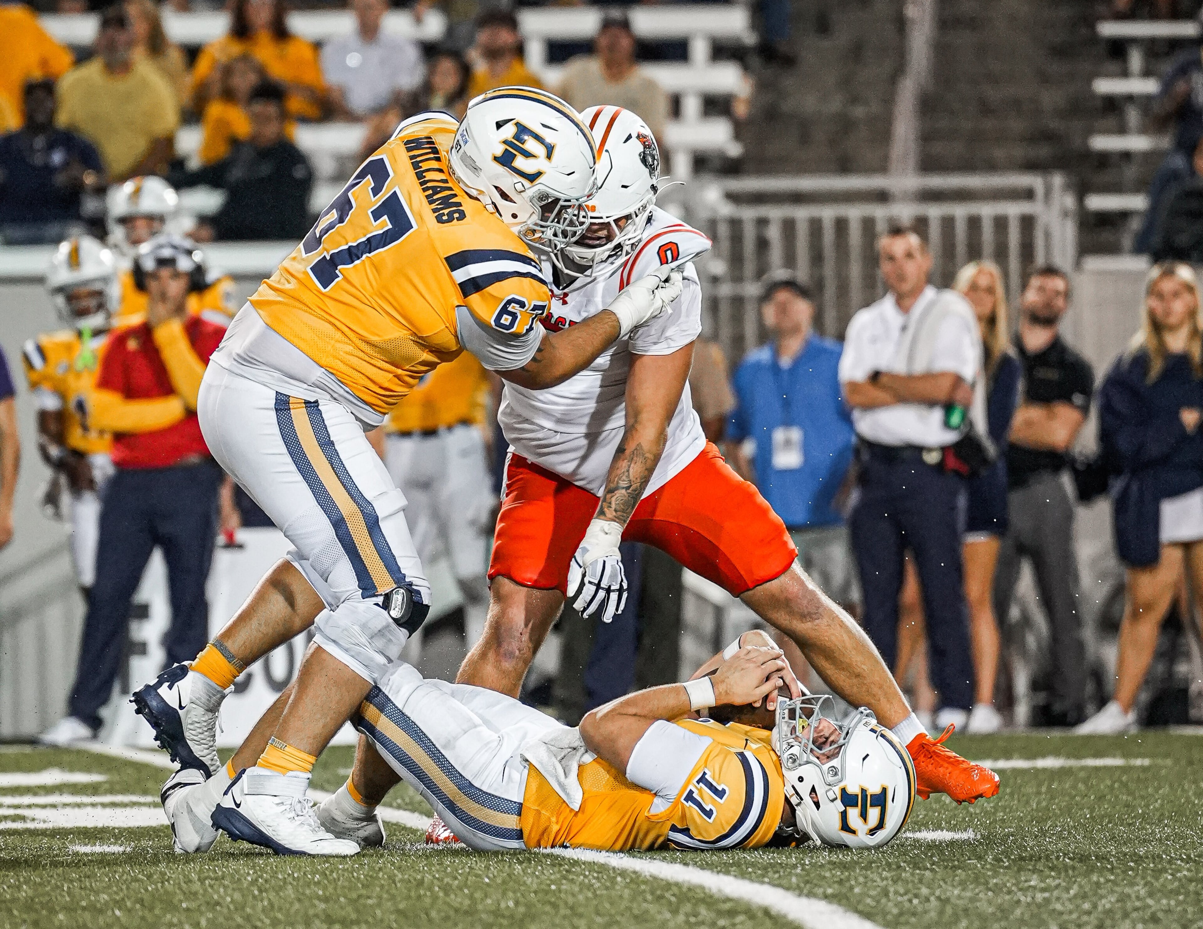 Mercer's Andrew Zock (center, background) is credited with a sack against East Tennessee State on Saturday, Sept. 27, 2025. (Courtesy of Mercer Athletics)