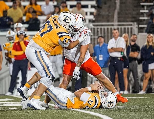 Mercer's Andrew Zock (center, background) is credited with a sack against East Tennessee State on Saturday, Sept. 27, 2025. (Courtesy of Mercer Athletics)