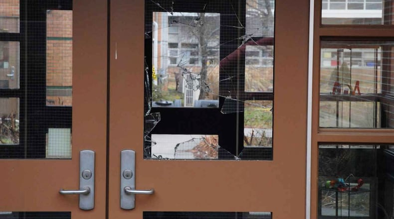 In this handout crime scene evidence photo provided by the Connecticut State Police, shows a damaged door of the Sandy Hook Elementary School following the December 14, 2012 shooting rampage, taken on an unspecified date in Newtown, Connecticut. A second report was released December 27, 2013 by Connecticut State Attorney Stephen Sedensky III gave more details of the the Newtown school shooting by Adam Lanza that left 20 children and six women educators dead inside Sandy Hook Elementary School after killing his mother at their home. (Photo by Connecticut State Police via Getty Images)