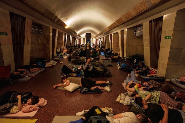 People sleep on the platform of a metro station as they take cover during a Russian attack on Kyiv, Ukraine, on Thursday, July 10, 2025. (AP Photo/Evgeniy Maloletka)