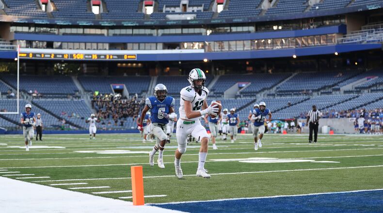 Roswell wide receiver Walt Warren scores on a 34-yard pass in the third quarter of their game against South Forsyth during the Corky Kell Classic at Georgia State Stadium Friday, August 18, 2017, in Atlanta.