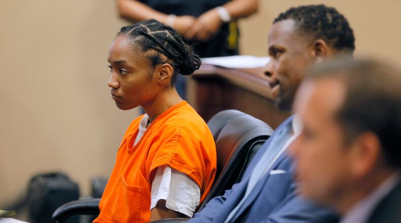 Dijanelle Fowler shows little reaction as she sits with her attorney, Charles Brant, during an Aug. 3, 2017 probable cause hearing.