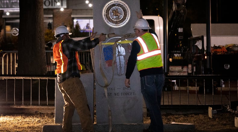 A crew works to remove a Confederate monument from its place on the grounds of the Gwinnett Historic Courthouse in Lawrenceville, Georgia, on Feb. 4. The Gwinnett County Board of Commissioners voted unanimously on Jan. 19 to remove the monument, overturning the decision of their predecessors from almost three decades before. In 1993, county commissioners gave permission for the monument to be installed at the request of the United Daughters of the Confederacy. (Casey Sykes/Atlanta Journal-Constitution/TNS)