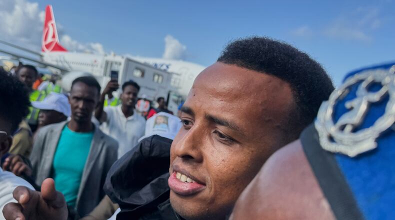Referee Omar Artan, who was denied entry to the United States, is welcomed by supporters upon his arrival in Mogadishu, Somalia, Wednesday, June 10, 2026. (AP Photo/Farah Abdi Warsameh)