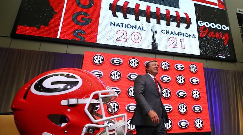 Georgia head coach Kirby Smart takes the stage for his press conference at SEC Media Days with 2021 National Champions flashing on the screen in the College Football Hall of Fame on Wednesday, July 20, 2022, in Atlanta. Curtis Compton / Curtis Compton@ajc.com