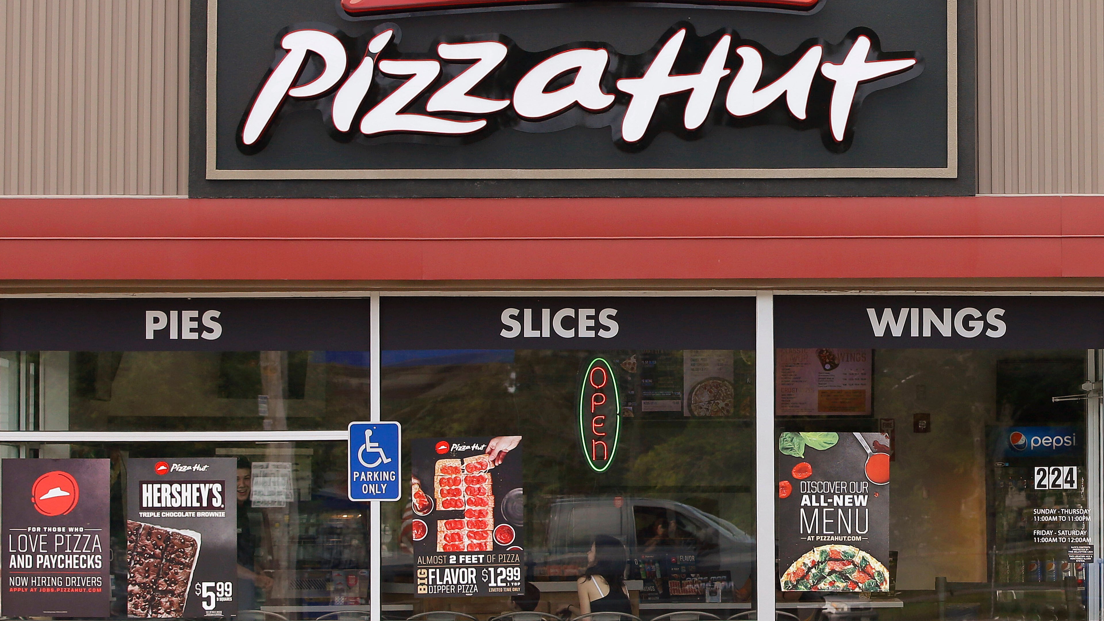 FILE - Pizza Hut is seen in in Taunton, Mass., on July 9, 2015. (AP Photo/Stephan Savoia, File)