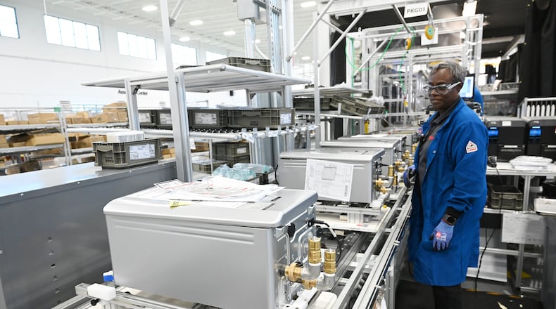 Gaynell Hurst assembles tankless water heaters at Rinnai America Corporation, Oct. 24, 2024, in Griffin. The company said it was threatened by pending rules for appliance efficiency. (Hyosub Shin/AJC)