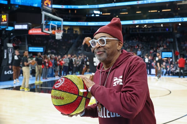 Film director, Morehouse man and so-called Knicks fan Spike Lee poses before a 2024 Hawks game. (Jason Getz/AJC)