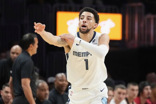 Memphis Grizzlies guard Scotty Pippen Jr. (1) gestures after scoring a three point basket during the first half of an NBA basketball game against the Miami Heat, Thursday, April 3, 2025, in Miami. (AP Photo/Marta Lavandier)