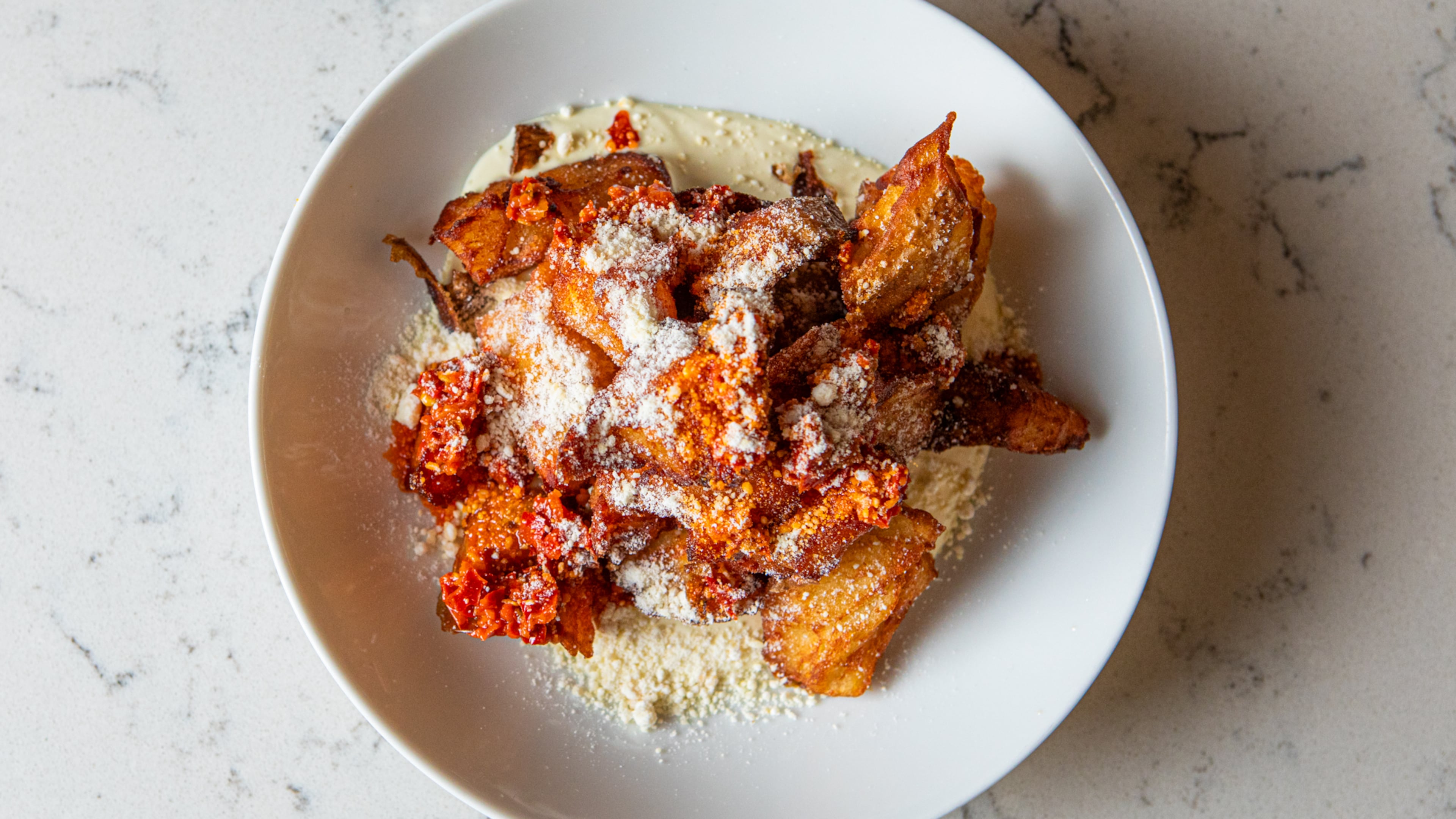 The White Bull’s Crispy Potatoes with Garlic Aioli. (Aaliyah Man for the AJC)