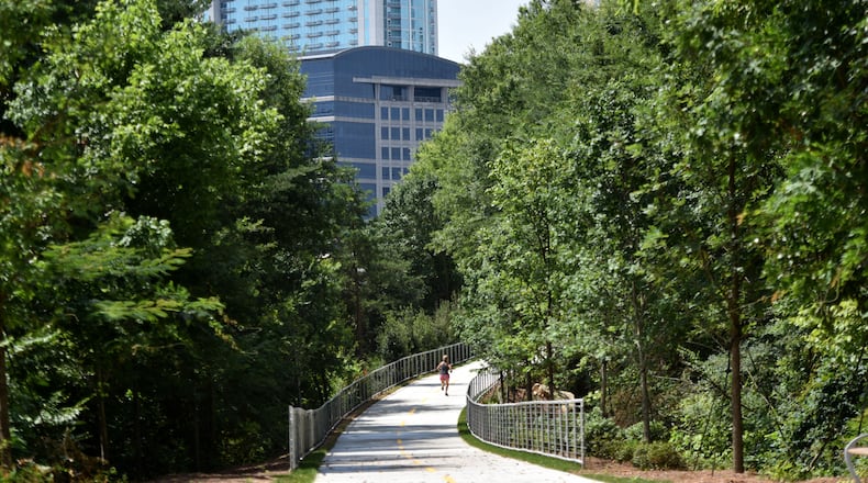 A woman jogs on PATH 400 on Thursday, July 2, 2015. Phase I of PATH 400, which opened in January, is a half-mile stretch of multi-use path that connects Lenox Road at Tower Place with Old Ivy Road. Georgia is one of only two states without a statewide trail organization, but all that is changing fast. There's a new impetus behind building a coalition from the many different groups who use trails for equestrian activities, mountain-biking, bicycling and walking and joining forces to complete a statewide trail network. After the second annual Georgia Trail Summit was held in Athens last month, this group decided to pursue incorporation into a nonprofit. HYOSUB SHIN / HSHIN@AJC.COM