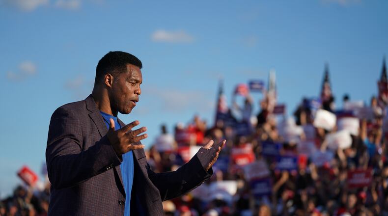 Republican Senate candidate Herschel Walker walks off the stage during a rally featuring former U.S. President Donald Trump on Sept. 25, 2021 in Perry, Georgia. (Sean Rayford/Getty Images/TNS)