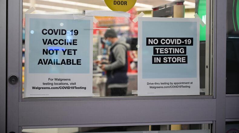A sign on the entrance to a pharmacy reads "Covid-19 Vaccine Not Yet Available" on November 23, 2020 in Burbank, California. (Robyn Beck/AFP via Getty Images/TNS)