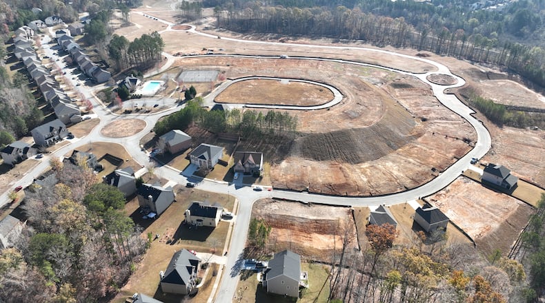 November 23, 2022 Atlanta - Aerial photograph shows Parkview Estates (left) in South Fulton and vast expanse of land (right), where a big company plans to build smaller and lower quality homes for rent, on Wednesday, November 23, 2022. This will be a story as part of the ‘Bulk Buyer project’ that looks at the buying/building of single-family homes that are rented out. We’re interested in the big investors that are doing the buying and the neighborhoods they are targeting and this tory will focus on a couple of neighborhoods. (Hyosub Shin / Hyosub.Shin@ajc.com)