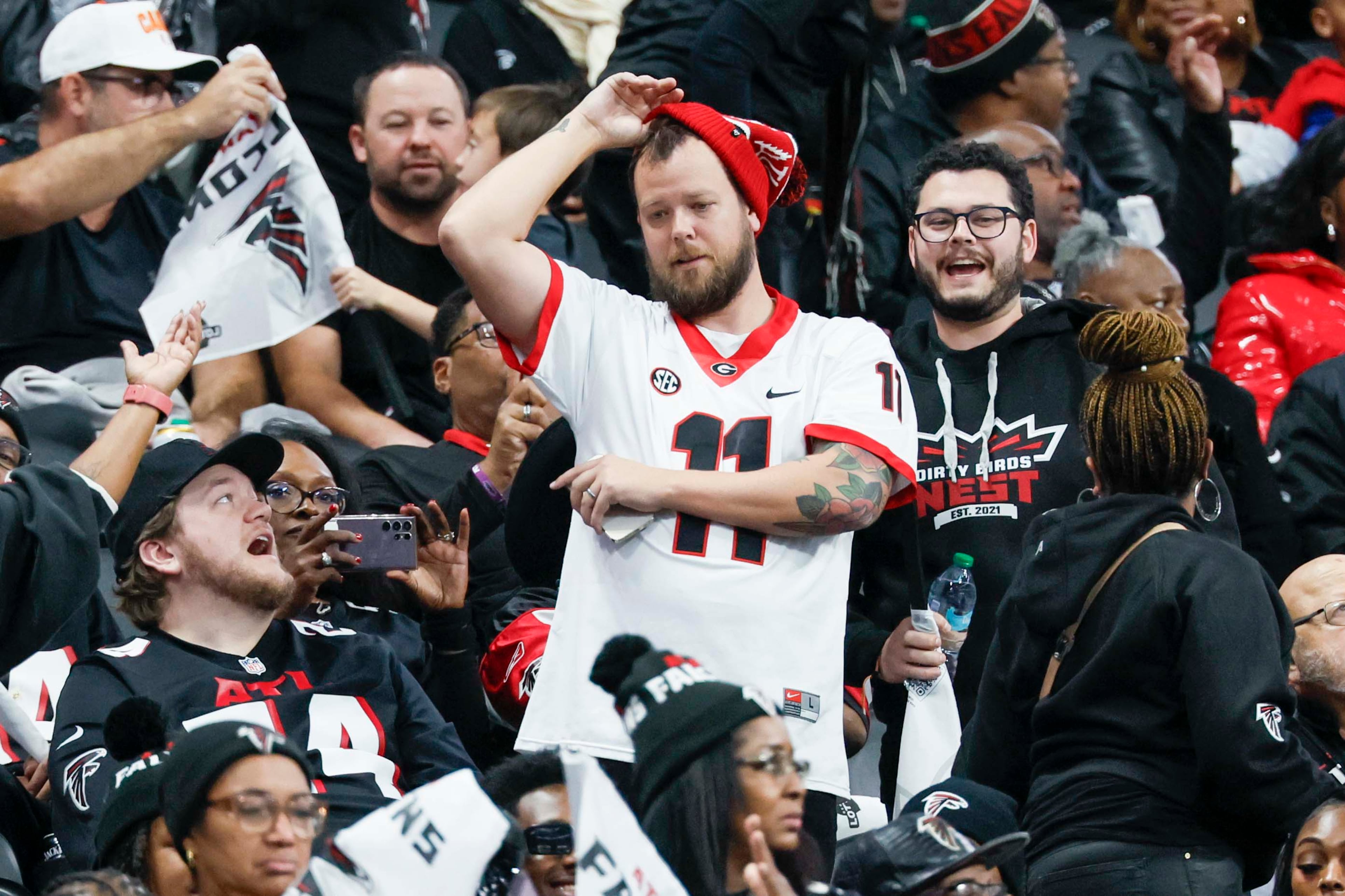 Atlanta Falcons fans react after the Seattle Seahawks score during the second half of an NFL game against the Seattle Seahawks at Mercedes-Benz Stadium in Atlanta on Sunday, Dec. 7, 2025.
(Miguel Martinez/ AJC)
