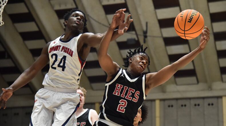 March 10, 2021 Macon - Holy Innocents' Garrison Powell (2) and Mr. Pisgah's Nate Gordon (24) fight for a rebound during the 2021 GHSA State Basketball Class A Private Championship game at the Macon Centreplex in Macon on Wednesday, March 10, 2021. Mr. Pisgah won 43-41 over Holy Innocents. (Hyosub Shin / Hyosub.Shin@ajc.com)
