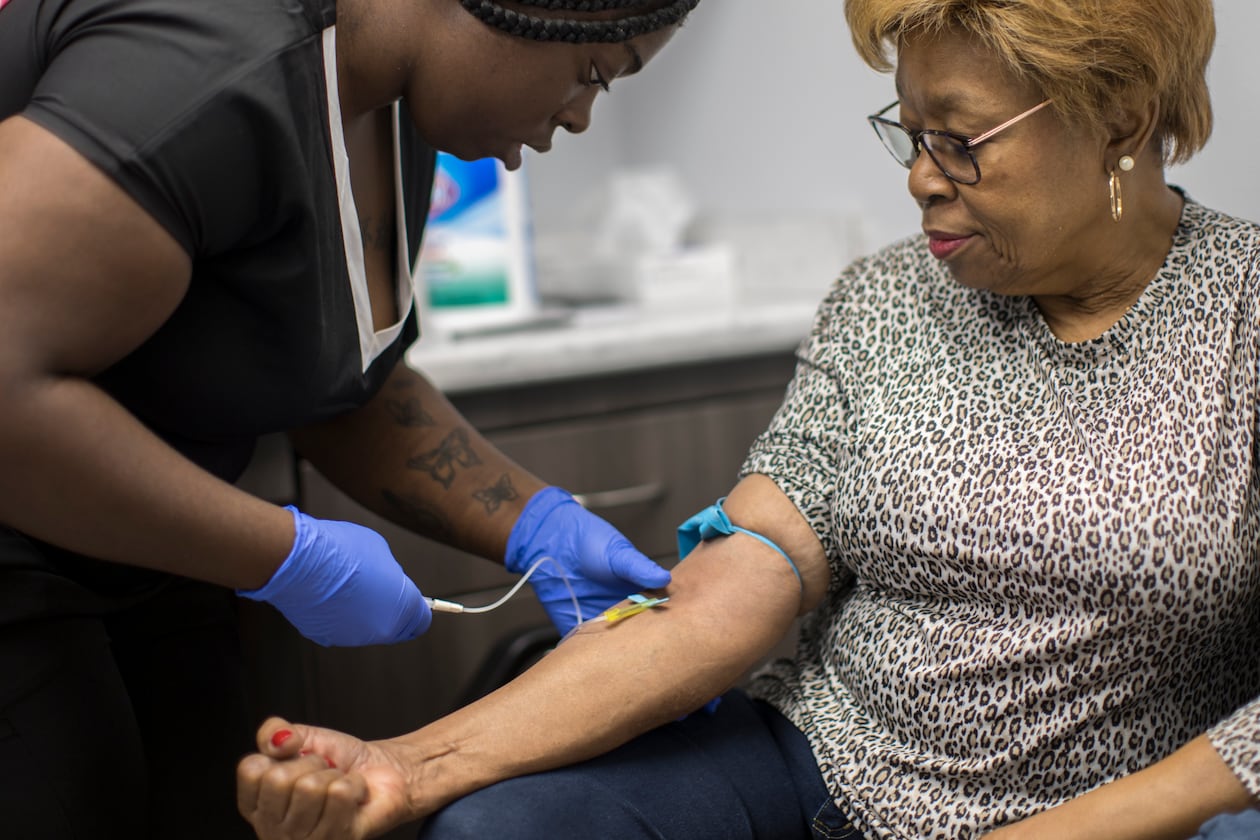 A phlebotomist working with Emory University takes a blood sample from Brunswick resident Etta Brown as part of a study by the college into potential long-term health effects of exposure to chemicals present in Superfund sites around the Brunswick area. The Emory researchers are analyzing blood samples for contaminants including lead, mercury, arsenic, cadmium and PCBs. (Stephen B. Morton/AJC)