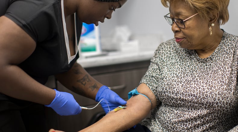 A phlebotomist working with Emory University takes a blood sample from Brunswick resident Etta Brown as part of a study by the college into potential long-term health effects of exposure to chemicals present in Superfund sites around the Brunswick area. The Emory researchers are analyzing blood samples for contaminants including lead, mercury, arsenic, cadmium and PCBs. (Stephen B. Morton/AJC)