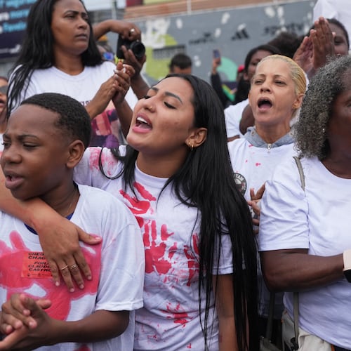 People protest days after a deadly police operation targeting a drug trafficking gang at the Complexo da Penha favela in Rio de Janeiro, Friday, Oct. 31, 2025. (AP Photo/Silvia Izquierdo)