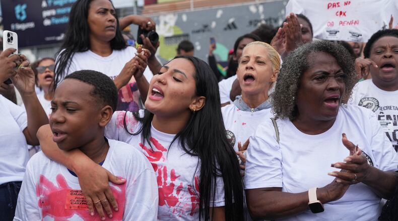 People protest days after a deadly police operation targeting a drug trafficking gang at the Complexo da Penha favela in Rio de Janeiro, Friday, Oct. 31, 2025. (AP Photo/Silvia Izquierdo)