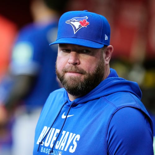 Toronto Blue Jays manager John Schneider pauses in the team dugout prior to a baseball game against the Arizona Diamondbacks, Saturday, April 18, 2026, in Phoenix. (AP Photo/Ross D. Franklin)
