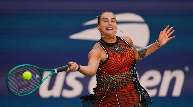 Aryna Sabalenka, of Belarus, returns the ball during a mixed doubles match at the U.S. Open tennis championships, Tuesday, Aug. 25, 2026, in New York. (AP Photo/Yuki Iwamura)