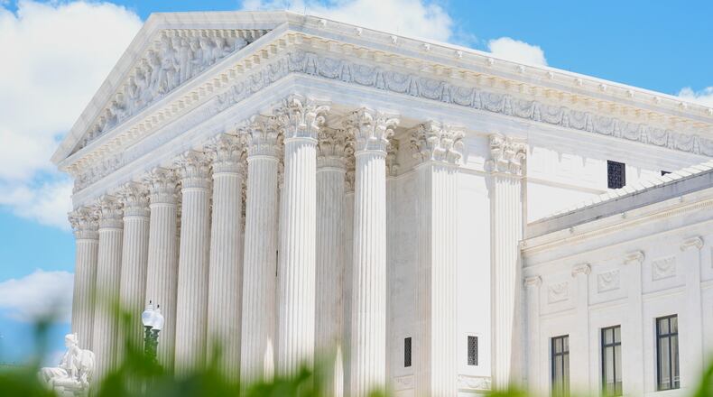 A statue titled the "Authority of Law" sits in front of the Supreme Court on Friday, May 15, 2026, in Washington. (AP Photo/Mariam Zuhaib)